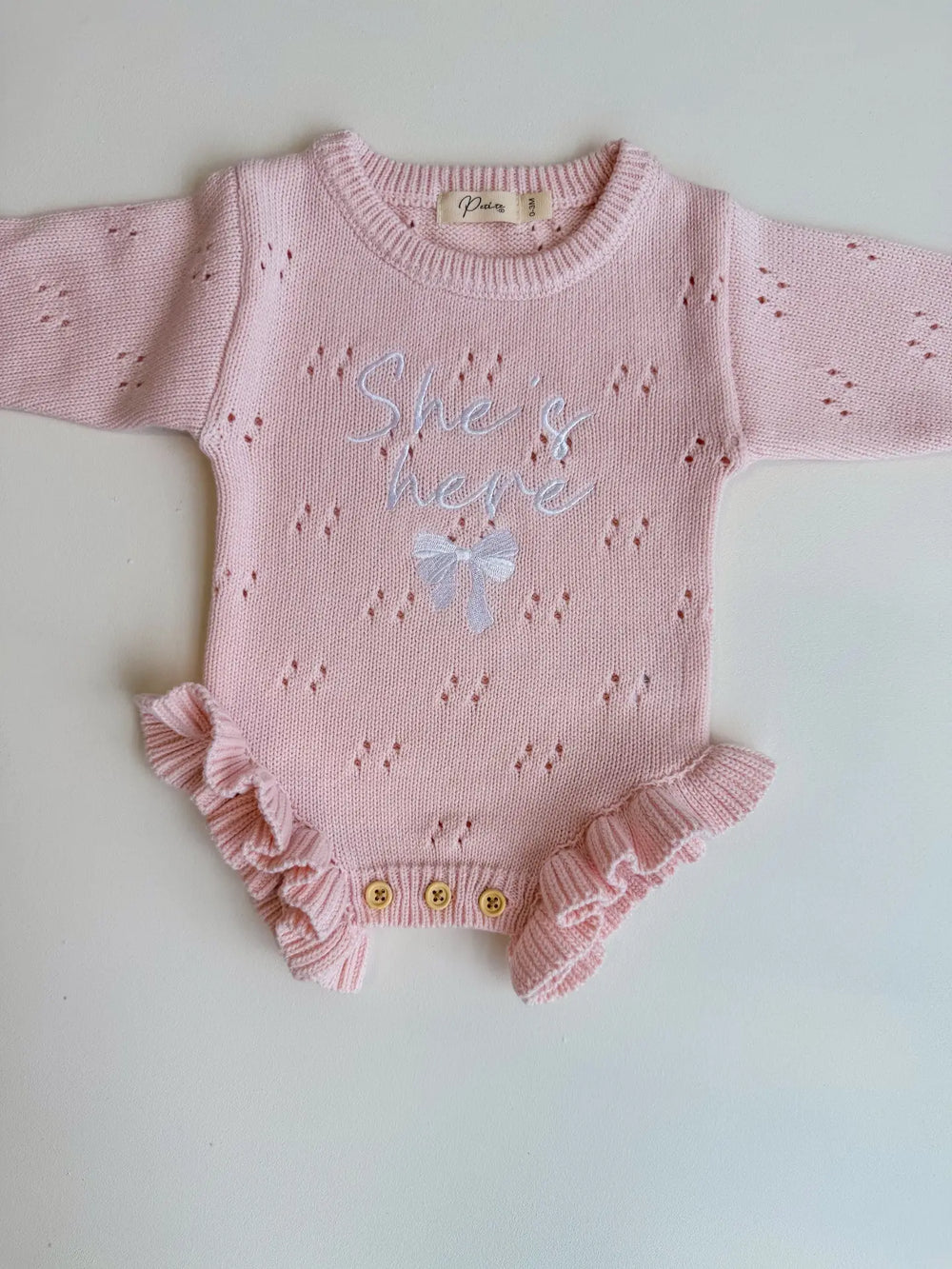 She's Here Bow - Pointelle Frill Romper | Baby Pink - Petite & Co